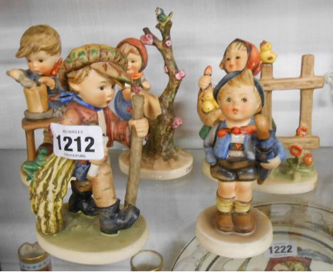 Five Hummel figurines each depicting a child in various activities