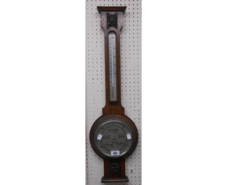 An early 20th Century oak banjo barometer thermometer with applied decoration, dial marked for John Dyson &amp; Sons, Leeds a