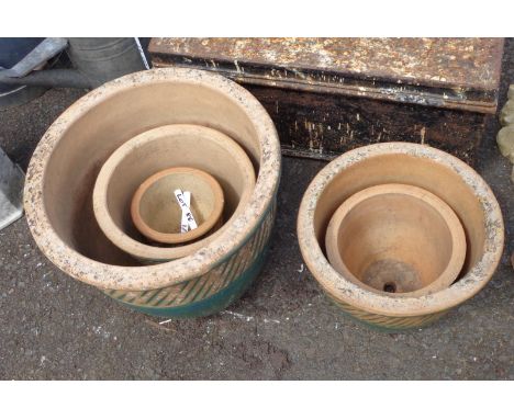 A set of five ceramic garden pots