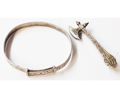 A small white metal bangle with foliate decoration - sold with a marked 'sterling' axe pattern brooch