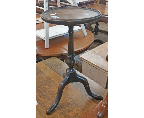 An oak topped wine table, set on turned pillar and tripod base