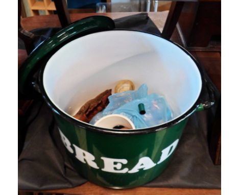 A late 20th Century heavy enamel bread bin of green colourway with white lettering containing a quantity of items including B