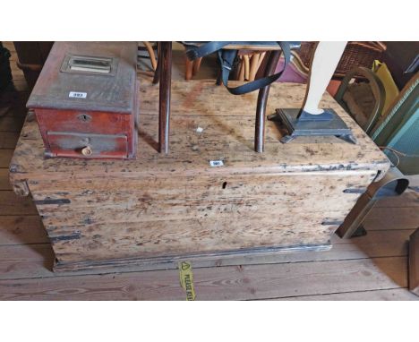 A 1.13m antique shipwright's style lift-top trunk with iron binding, flanking drop handles and later adapted drawer fitted in