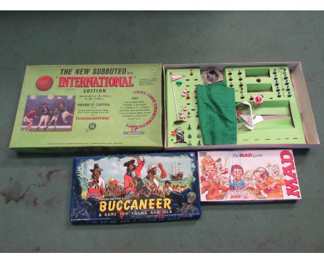 A Subbuteo International Edition box and part contents, Waddingtons Buccaneer Game and Parker 'The Mad Game' (3)