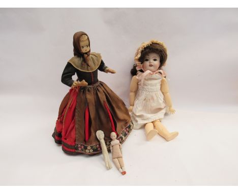 A Simon &amp; Halbig bisque head doll on jointed composition body together with two miniature bisque dolls and another with p