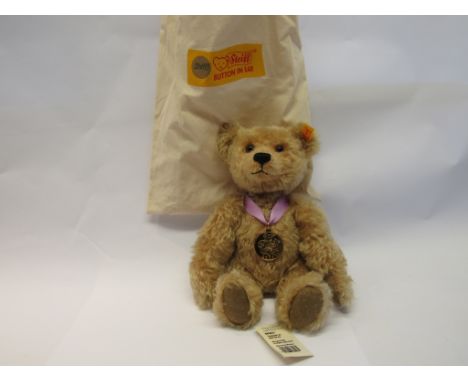 A Steiff 660931 '2003' jointed mohair teddy bear with medallion, yellow tag and button to ear, 30cm tall, in Steiff dust bag