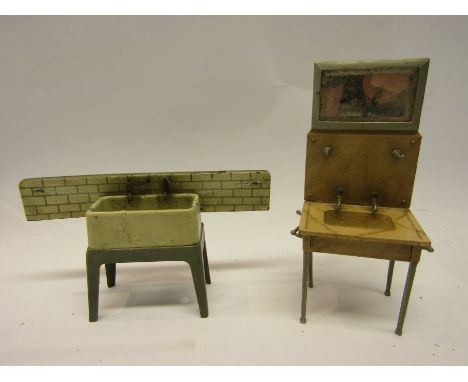 A painted metal dolls house wash basin with mirrored back, marked Germany (approx 14cm tall) and a similar butler sink with t