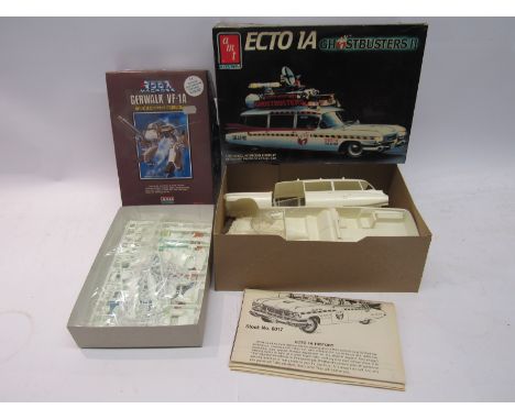 A boxed Ertl AMT Ghostbusters II Ecto1A 1:25 scale plastic model kit and 1:100 scale Macross Gerwalk VF-1A (2-contents unchec