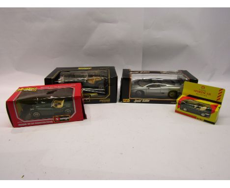 A Burago 1:18 scale diecast Jaguar SS100 and 1:24 scale Jaguar XK120 Roadster, Maisto 1:18 scale Jaguar XJ220 and a Shell Cla