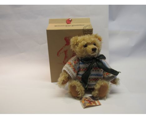 A boxed Steiff Classic Series 661365 jointed mohair bear, dressed in a home-made knitted jumper, yellow tag and button to ear