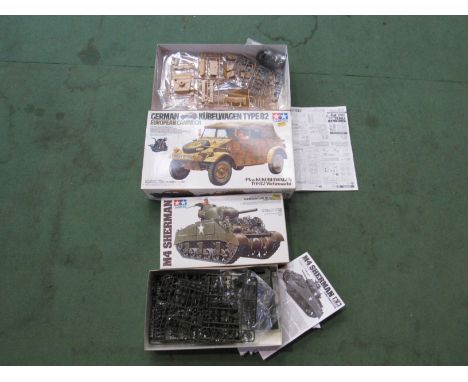 Two Tamiya military plastic model kits to include 1:16 scale German Kubelwagen Type 82 and 1:35 scale M4 Sherman Tank (2-cont
