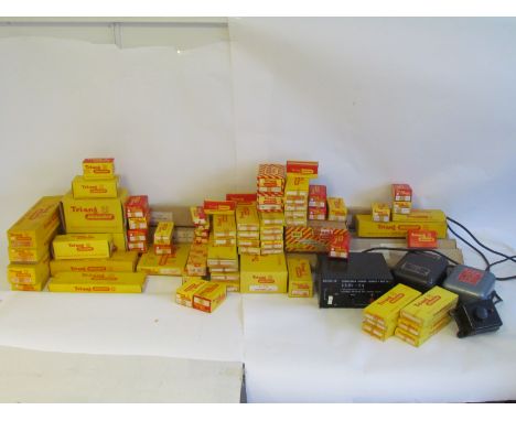 A large collection of mostly boxed Tri-ang TT gauge track, points, point motors, platforms, engine sheds, signal boxes etc