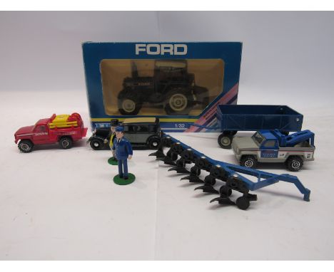 A boxed Ertl 1:32 scale diecast Ford TW5 tractor together with unboxed Ertl trailer, plough and Thomas the Tank Engine figure