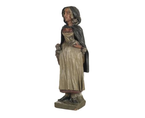 * Lancashire Witch. A large terracotta figure believed to be the Lancashire witch, the polychrome painted figure modelled ful