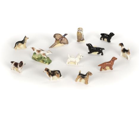 * Royal Worcester. A collection of animal menu holders, comprising Airedale (2959), Cocker Spaniel (2961), Alsation (2971), C