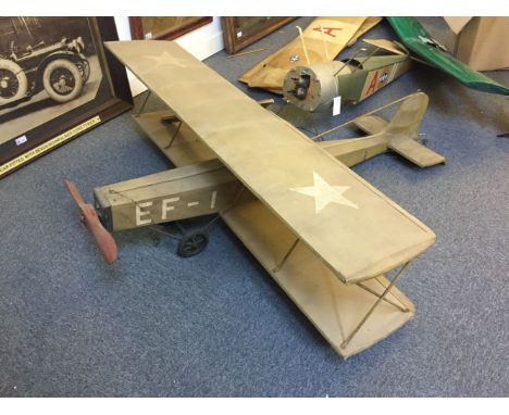 * Model Aircraft. A collection of large scale model aircraft, including an American biplane, green fabric fuselage and wings,