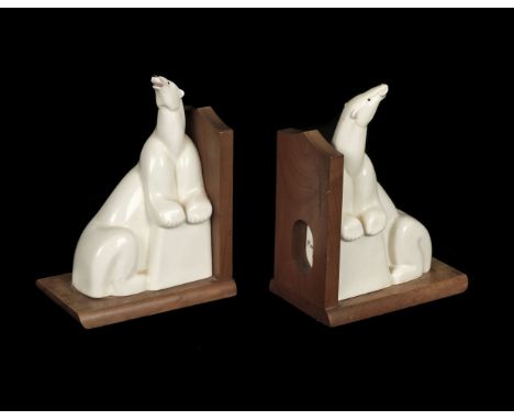 * Royal Worcester. A pair of bookends, modelled as "Sam" the Polar Bear by Ethelwyn Baker, hairline cracks, 16.5cm high mount