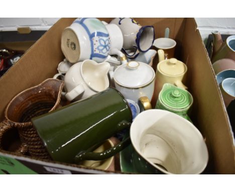 A selection of ceramic milk cream and water jugs