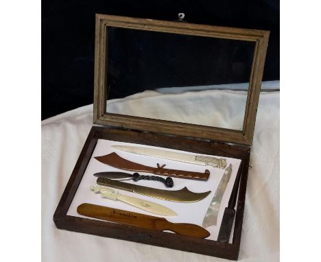 Small display cabinet with 8 various letter openers