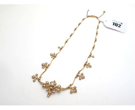An Edwardian Seed Pearl Necklace, of graduated design (lacking central drop), stamped "15ct", overall length approximately 37