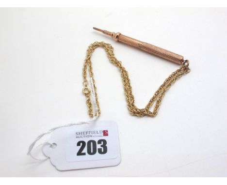 A Sliding Pencil, with engine turned decoration, on a modern 9ct gold fancy link chain. 