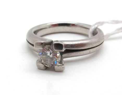 A Modern Single Stone Diamond Ring, the brilliant cut stone chunky claw set, stamped "950" (finger size M).