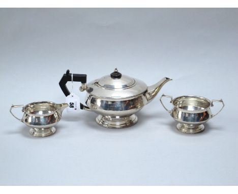 A Hallmarked Silver Three Piece Tea Set, Mappin &amp; Webb, Sheffield 1931, of Art Deco style with beaded edge and angular ha