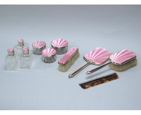 A Hallmarked Silver and Pink Enamel Dressing Table Set, Albert Carter, Birmingham 1935, 1936, comprising two brushes, hand mi