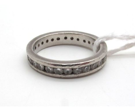 A Modern Diamond Set Eternity Band, channel set throughout with uniform stones, stamped "Pt950" (finger size M) (noticeable w