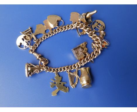 A 9ct gold watch chain curb link charm bracelet.