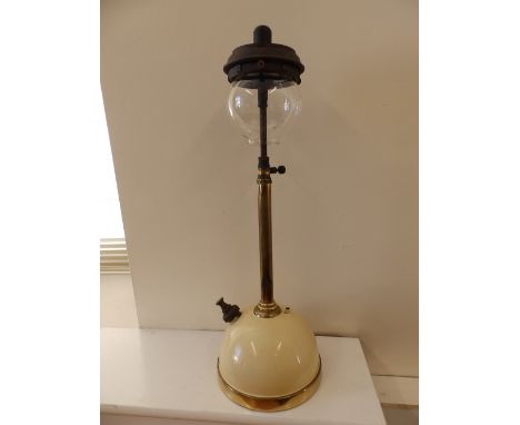 A Tilley lamp on enamel base.