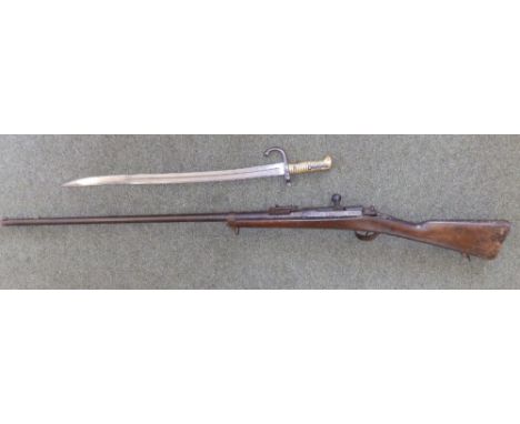 A French 1866 model Chassepot rifle (woodwormed) together with a sabre bayonet,