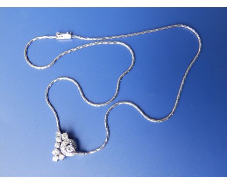 A white gold pendant necklace.