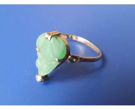 A Victorian jade ring set with small diamonds.
