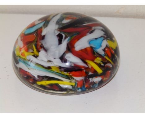 A scrambled cane glass paperweight.