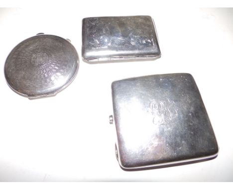 Two silver cigarette cases and a compact. (3)