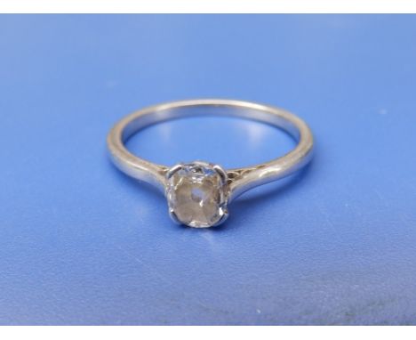 A diamond solitaire ring, the cushion cut stone weighing approximately 0.50 carat on white metal shank stamped 'PLATINUM'.