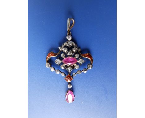 A late 19th/early 20thC diamond & ruby set pendant, having red guilloche enamel details and with pear-shaped ruby swing, 1.5”