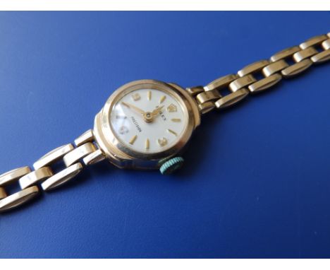 A lady's 9ct gold Rolex bracelet wrist watch.