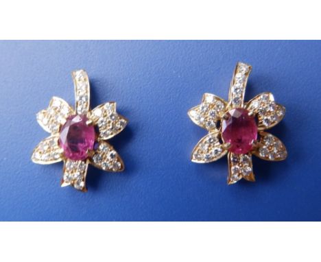 A pair of ruby and diamond floral spray earrings.