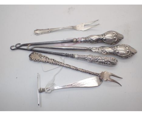 Pair of silver handled button hooks silver pusher and two white metal forks
