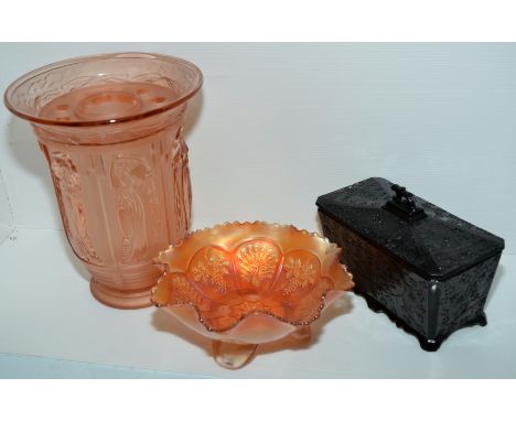 Carnival Ware dish with peacock and grape design, black glass tea caddy, small cranberry pot on bun feet and a pressed glass 