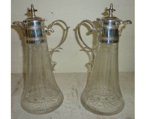 Pair of silver plated and etched glass claret jugs