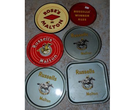 Four tin advertising trays for 'Russells Malton' & 'Rose's Malton' tin tray & 'Russells Winner Ales' enamel tray