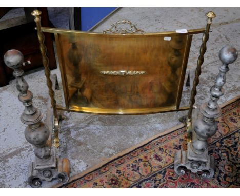 Pair of wrought metal fire dogs and a brass fire screen (3)