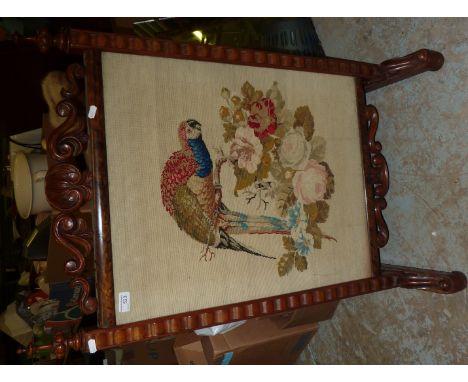 Victorian walnut framed fire screen with wool work panel depicting parrot in floral scene 