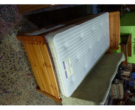 Pine framed single bed with a pull out pop up bed 