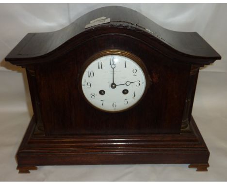 Edwardian oak cased mantel clock of architectural form with quarter fluted pillars, brass capitals, French two train movement