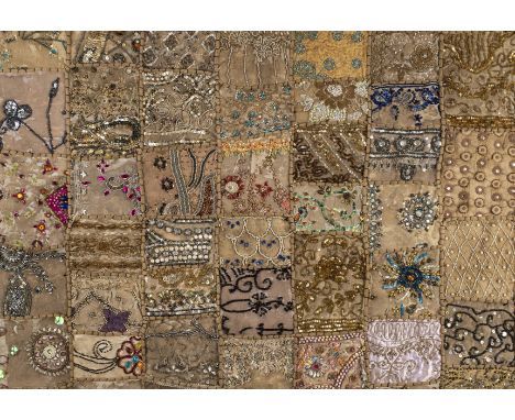 *Embroidery. A large beaded Indian-style panel, circa 1960s,  decorative fabric panel, composed of numerous different irregul