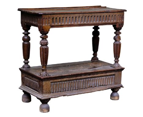 *Buffet. An oak buffet, late 16th century,  the rectangular moulded top above a fluted frieze, on turned ribbed front support